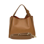 Warm brown pebbled leather tote bag with a single top handle, orange lining, and a detachable strap with gold-toned hardware.