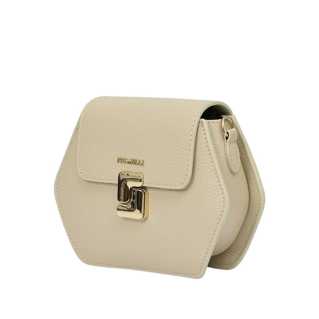 Ivory pebbled leather hexagonal bag with a curved flap, gold-toned "PIUMELLI" logo, and a gold-toned twist-lock clasp.