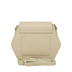 Ivory pebbled leather hexagonal bag with a flap closure, a back slip pocket, and an adjustable strap with gold-toned hardware