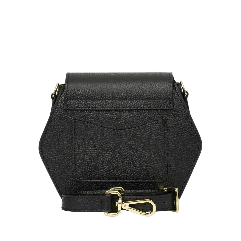 Black pebbled leather hexagonal flap bag with a back slip pocket and an adjustable strap featuring gold-toned hardware.