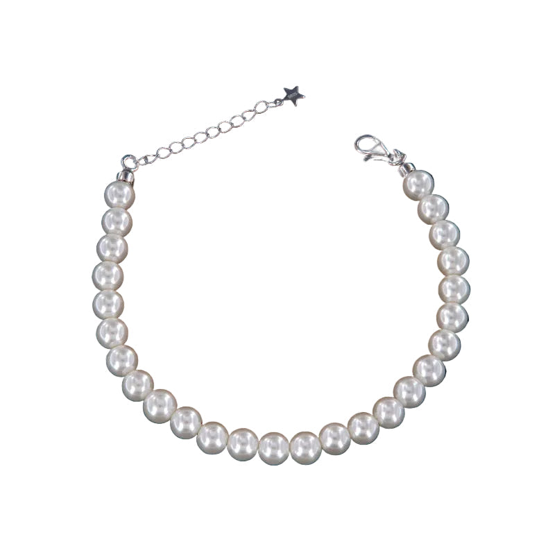 A single strand bracelet featuring numerous round, lustrous white pearls, with a silver-toned lobster clasp and chain extende