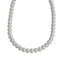 White spherical pearl necklace with a lustrous finish, arranged in a single strand