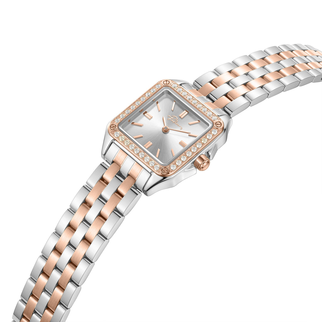 High-angle studio perspective showing the square geometry of the two-tone watch casing, the texturing of the rose gold crystal bezel, the setting crown, and the fluid assembly of the silver and rose gold link band.