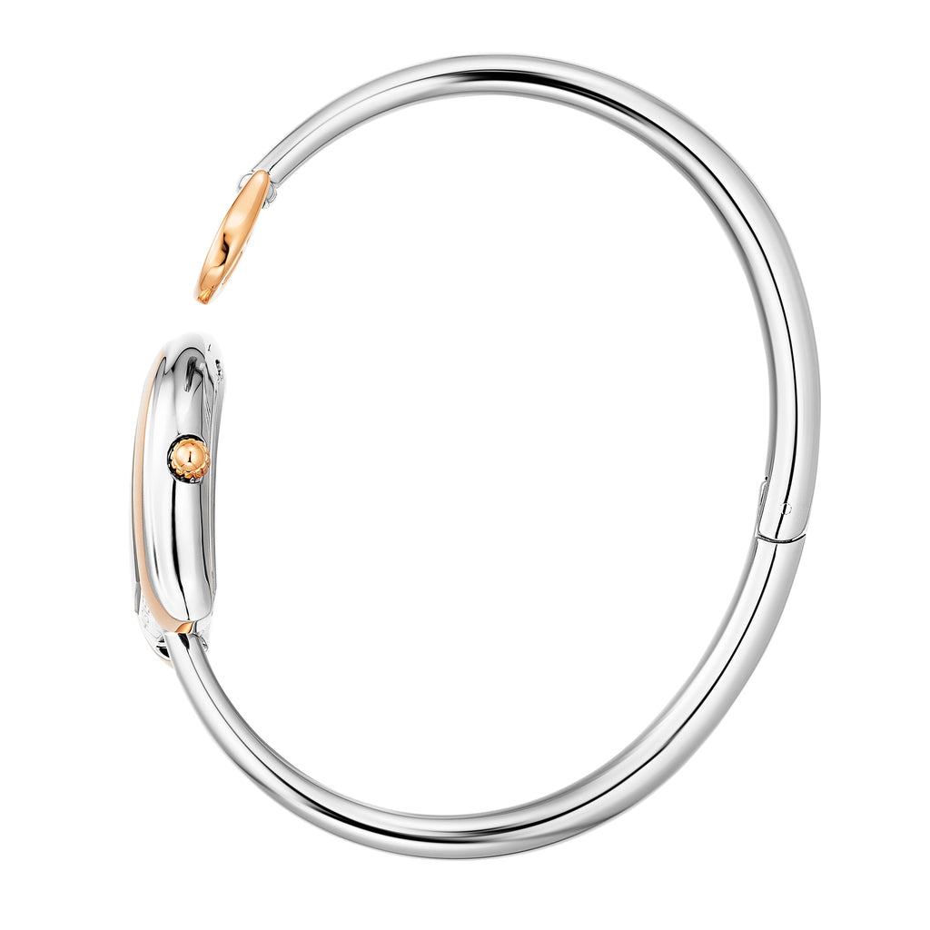 A side profile photograph accentuating the complete circular architecture of the polished rigid steel bangle, the integrated rear case hinge, and the fluted rose gold setting crown on the side of the horseshoe watch head.