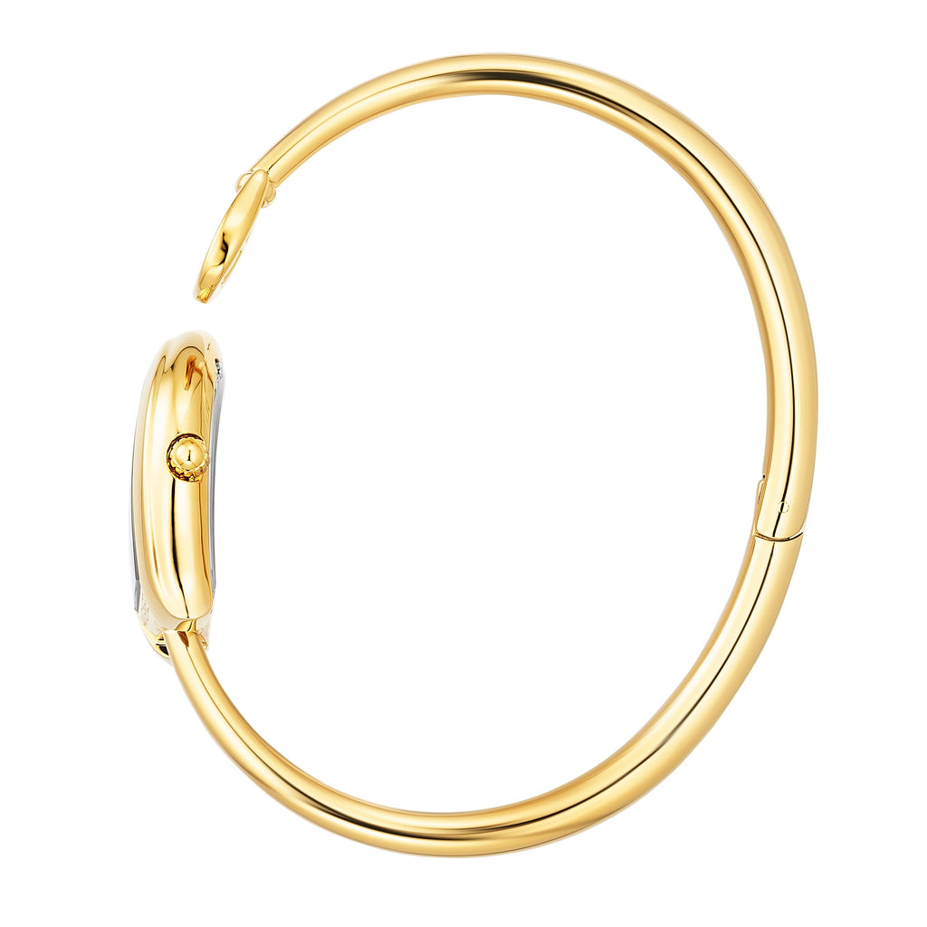 A side profile shot showcasing the complete circular architecture of the polished gold-plated rigid bangle, the integrated case hinge, and the fluted crown detailed on the side of the horseshoe watch head.
