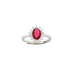 Silver-toned adjustable ring with a central oval ruby-red stone surrounded by a halo of small clear round stones.