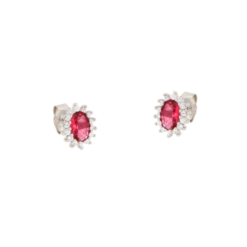 Pair of silver-toned stud earrings, each featuring an oval ruby-red central stone surrounded by a halo of clear faceted stone