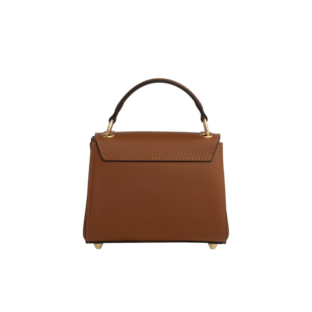 Structured brown leather top handle bag with a flap closure, dark handle, and gold-toned hardware and feet.