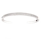 Silver-toned open-cuff bangle adorned with two rows of clear, rectangular-cut simulated stones.