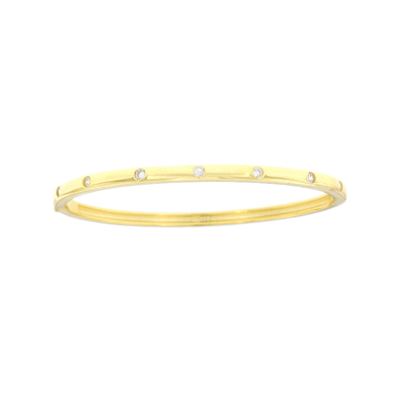 Gold-toned bangle bracelet with six evenly spaced clear round stones