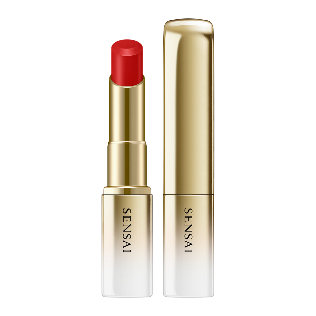 Sensai lipstick with red cap and gold casing on a white background.