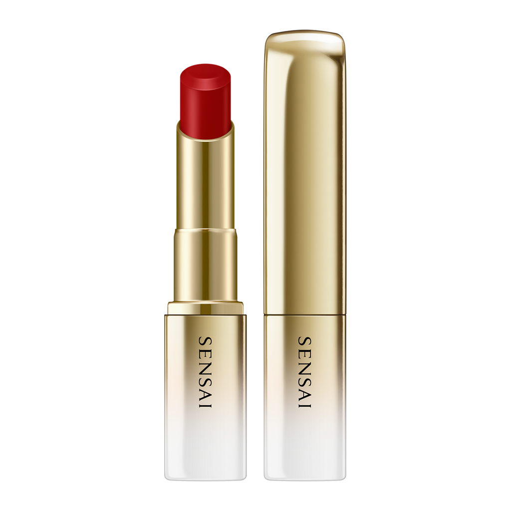 Sensai lipstick with red shade and gold casing on a white background.