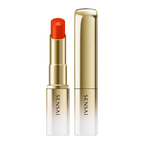 Sensai lipstick with red cap and gold casing on a white background.