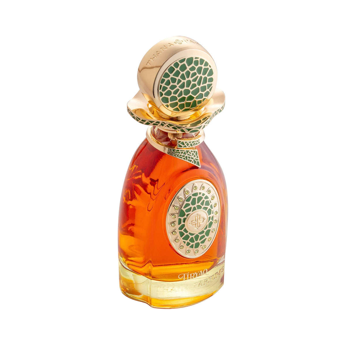 Amber perfume bottle with gold-toned cap and circular emblem featuring green mosaic patterns. Ornate gold-toned collar with g
