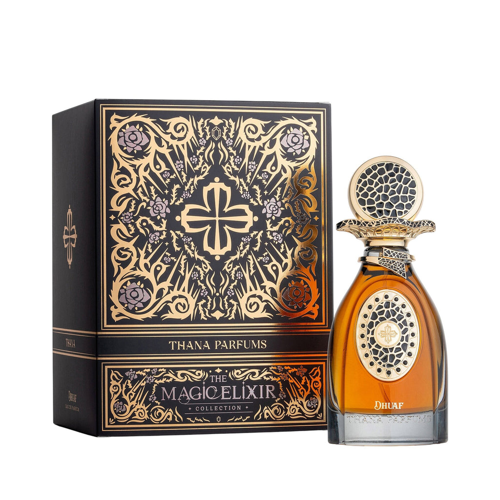 Black box with gold-toned ornate patterns. Amber perfume bottle with a gold-toned cap and oval design, both featuring black m