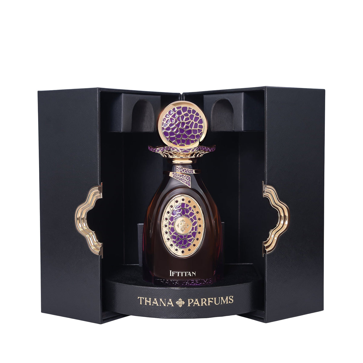 Dark amber perfume bottle with ornate gold-toned cap and purple mosaic top. Gold-toned oval emblem with purple pattern on fro