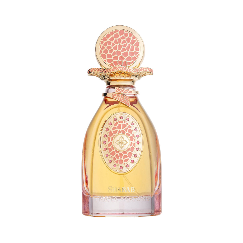 Gold-toned and light pink Thana Parfums Shabab EDP bottle with an ornate cap and decorative oval embellishment.