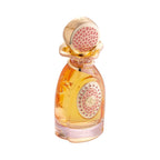 Amber perfume bottle with a gold-toned cap and wavy collar. Pink patterned inserts on the cap and a central emblem with pink