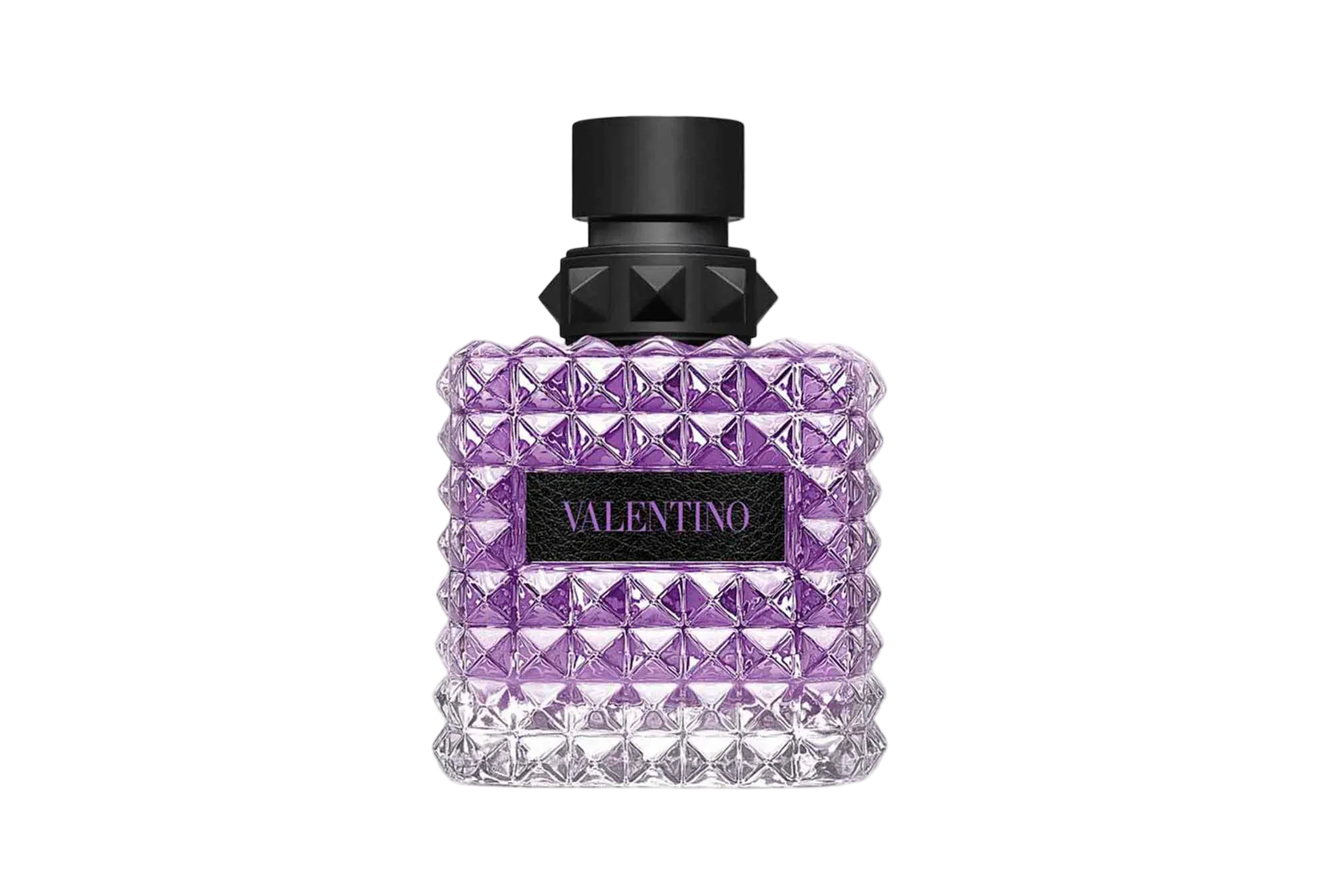 A Valentino Uomo Born In Roma Stravaganza fragrance bottle for men, featuring the signature pyramid rockstud glass design with a clear-to-purple gradient. The bottle is topped with a matte black cap and a black textured label displaying the "VALENTINO" logo in purple.