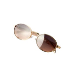 Vayo Glint sunglasses with gold metal frame and brown gradient lenses