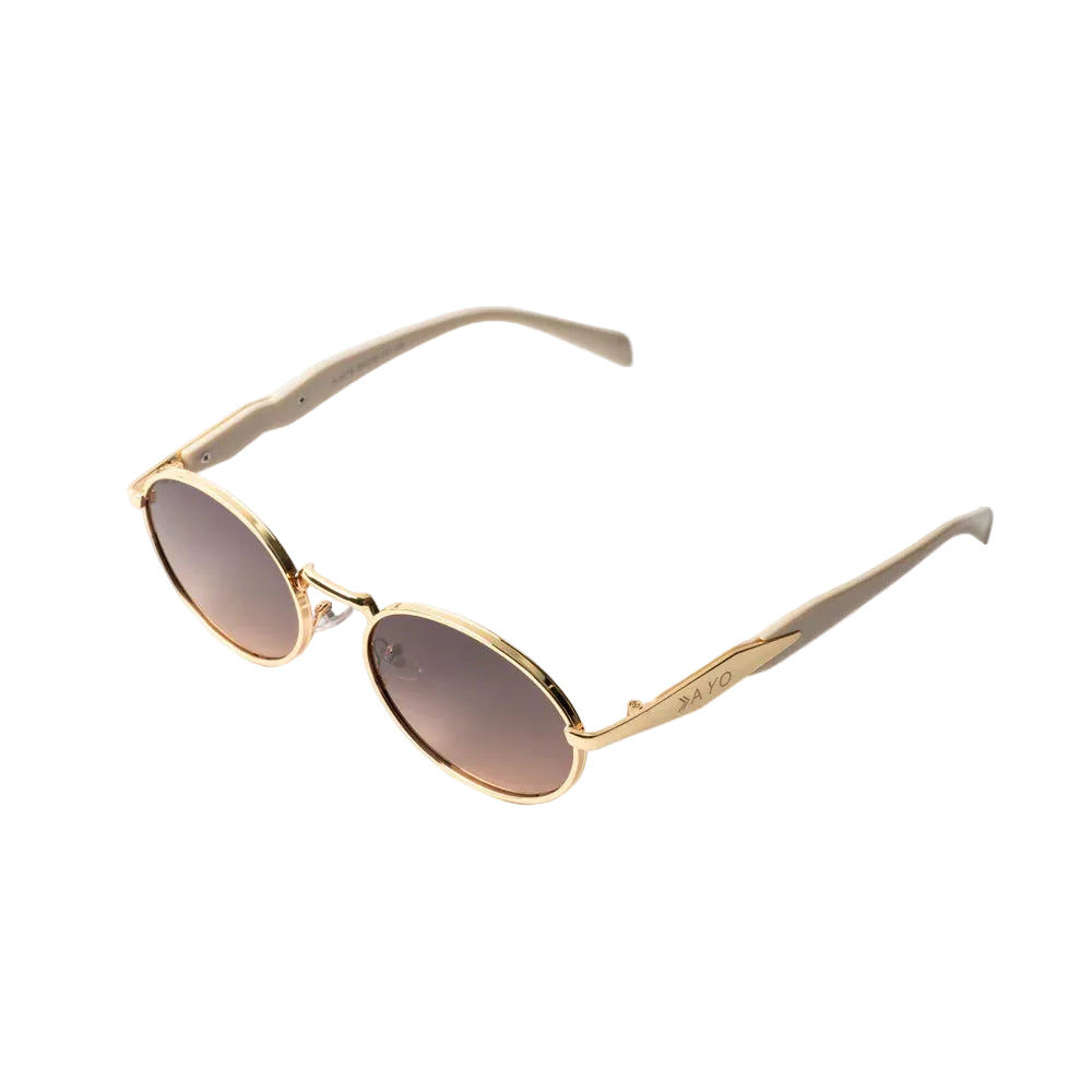 Vayo Glint sunglasses with gold metal frame and brown gradient lenses