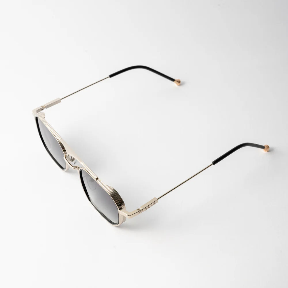 Vayo Solaris Edge metal sunglasses with dark blue lenses and sleek geometric frame