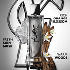 Clear glass rectangular perfume bottle with a silver-toned back panel, black YSL logo, and a shiny silver-toned block cap.