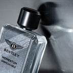 Bentley Momentum Eau de Toilette for Men 100ml in a sleek clear bottle with silver cap, available for online purchase at Paris Gallery Qatar
