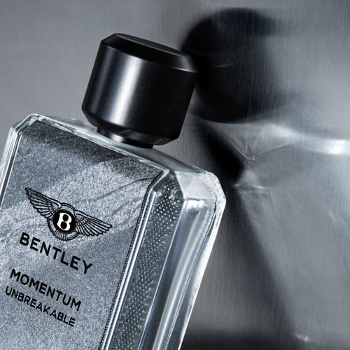 Bentley Momentum Eau de Toilette for Men 100ml in a sleek clear bottle with silver cap, available for online purchase at Paris Gallery Qatar