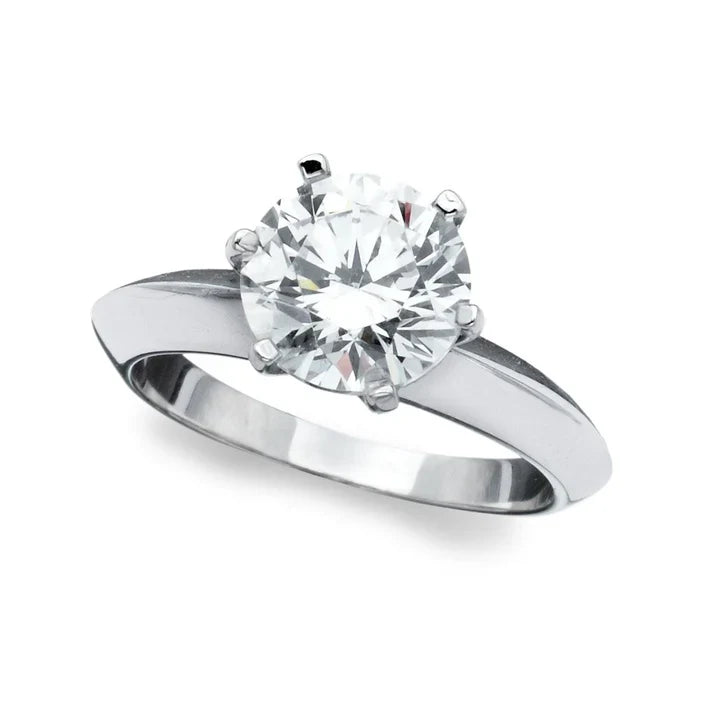 Silver-toned plated ring with a large, round, clear brilliant-cut cubic zirconia stone in a six-prong setting.