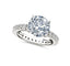 Silver-toned pavé engagement ring with a large, clear round brilliant-cut central stone and smaller clear stones on the band.