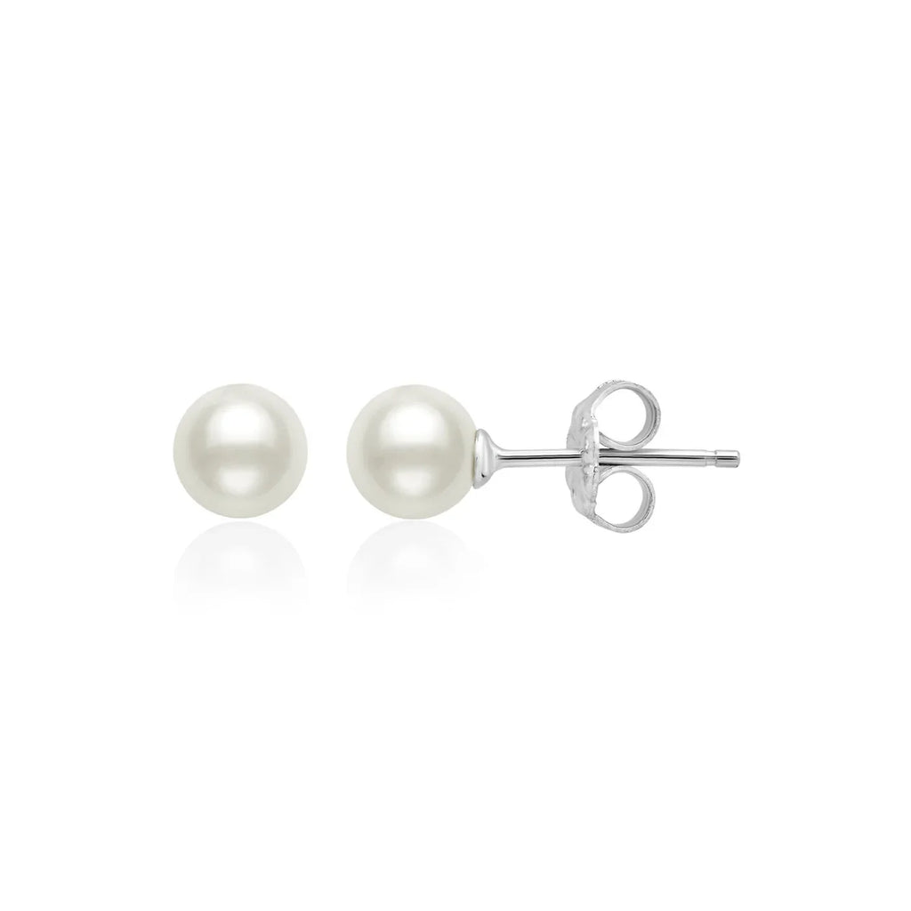 Pair of white spherical pearl stud earrings with silver-toned posts and butterfly backings.