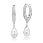 Silver-toned pavé-set oval hoop earrings with white teardrop pearl drops.