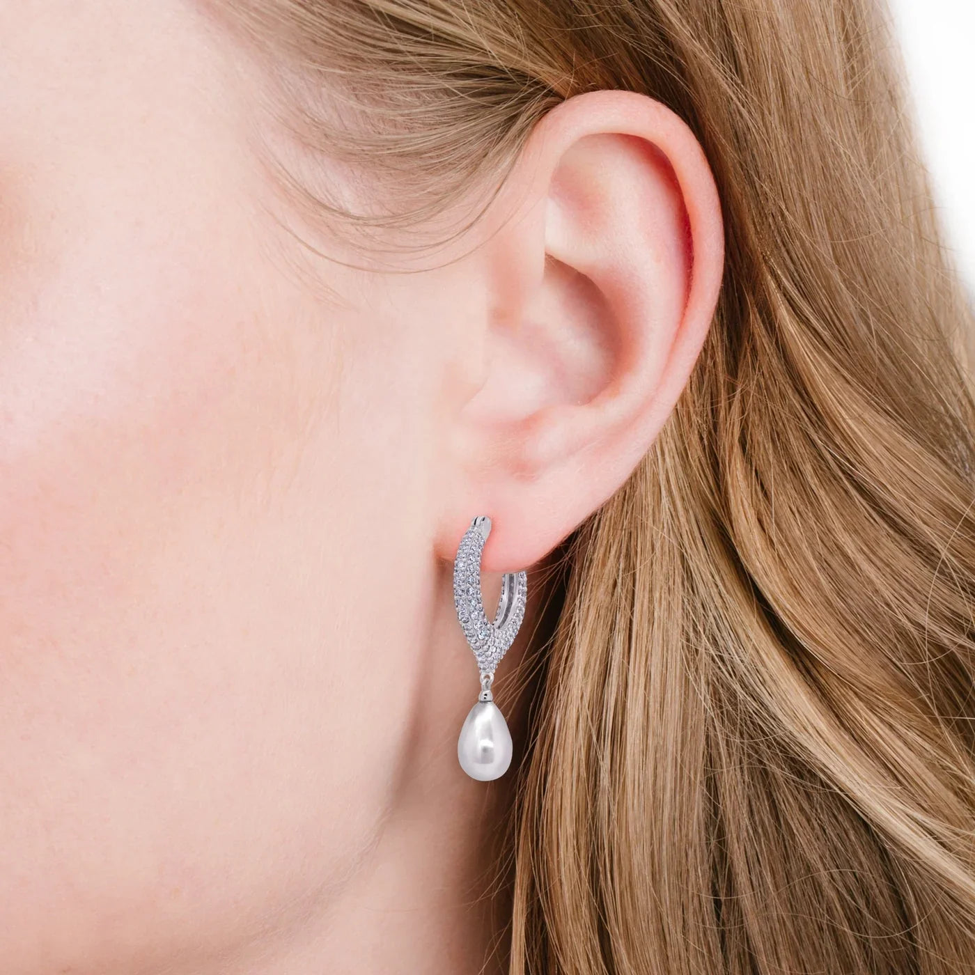 Silver-toned pavé hoop earring with a white tear-shaped pearl drop.