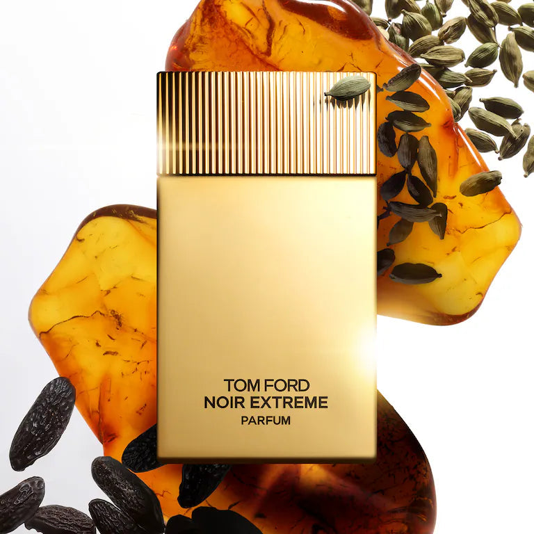Rectangular perfume bottle with a matte gold body and a gold-toned cap featuring vertical ridges. Black text reads 'TOM FORD