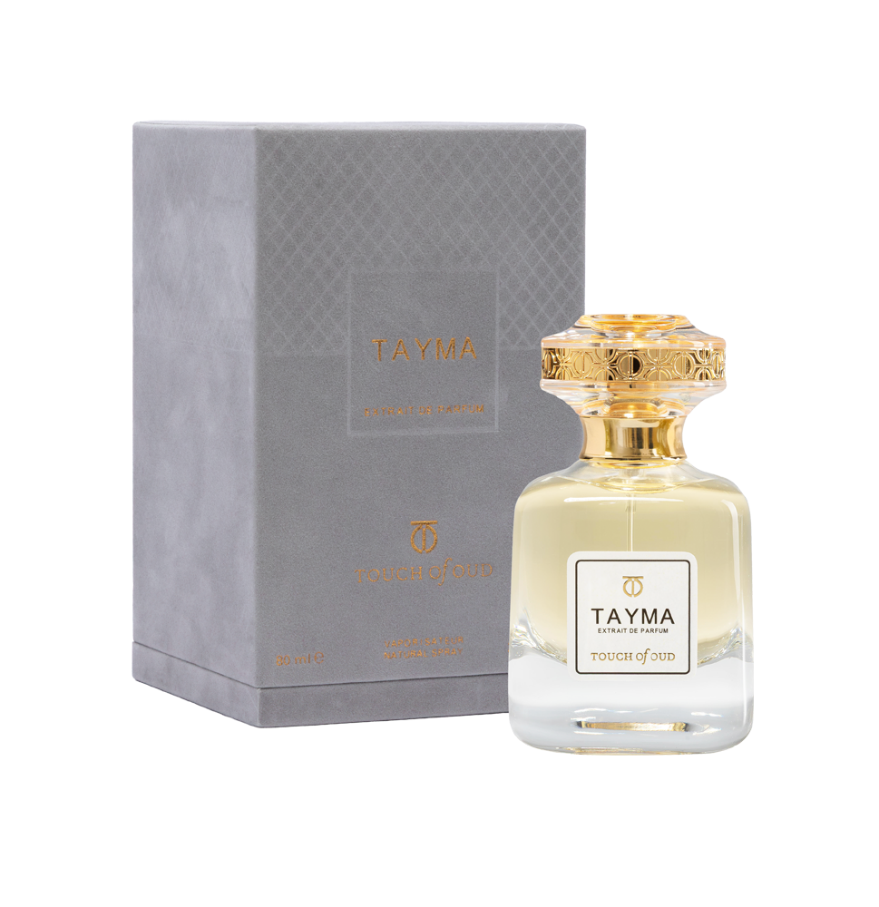 Touch of Oud Tayma 80ml perfume bottle displayed next to its premium grey textured gift box on Blue Salon Online. The elegant glass bottle showcases its pale gold fragrance fluid, paired with a matching debossed presentation box.