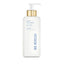 White rectangular body lotion bottle with bevelled edges, a gold-toned collar, and a white pump dispenser.