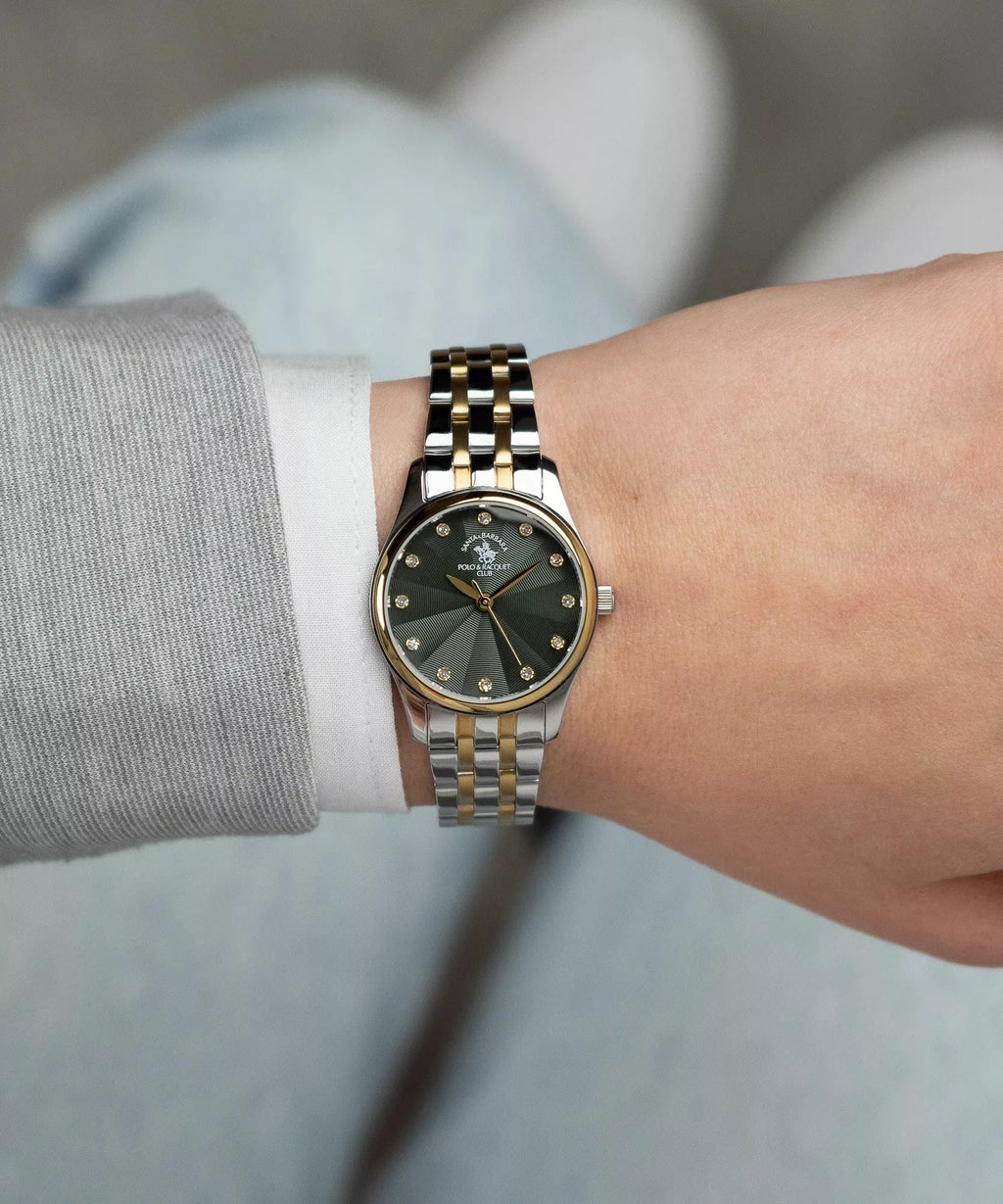Two-toned watch with a dark green radial-textured dial, gold-toned bezel, clear stone hour markers, and a silver-toned and go