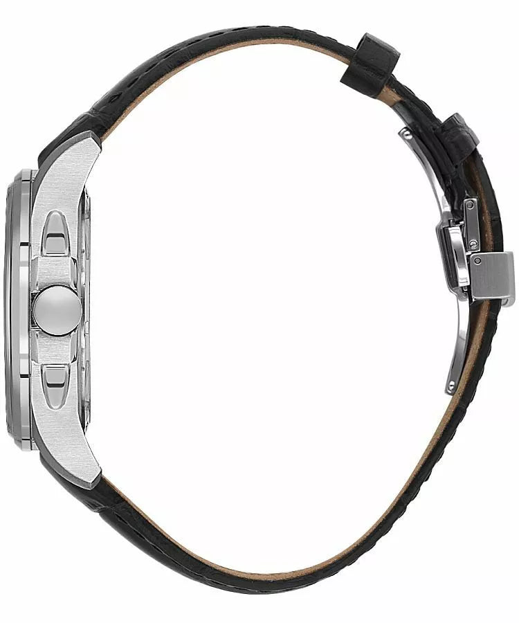 Side view of a watch with a silver-toned case, crown, and pushers. It has a black textured leather band with a silver-toned d